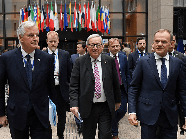 EU chief Brexit negotiator Michel Barnier (L), President of the European Commission Jean-Claude Juncker (C) and European Council President Donald Tusk on their way to a press conference following a special meeting of the European Council to endorse the draft Brexit withdrawal agreement and to approve the draft political declaration …