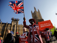 TOPSHOT - Pro-Brexit activists march outside the Houses of Parliament in central London on February 27, 2019. - Prime Minister Theresa May will today face a vote by MPs over her newly revised Brexit strategy, which allows for a possible request to delay Britain's EU departure if her divorce deal …