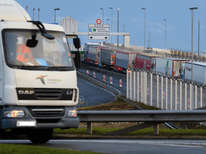 CALAIS, FRANCE - MARCH 06: A line of trucks snakes along an access road leading towards the port of Calais on March 06, 2019 in Calais, France. Delays have increased as customs agents work-to-rule in a bid to receive more pay, ahead of the prospects of a demanding period during …