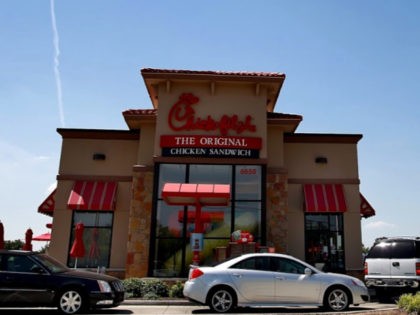 Drive through customers wait in line at a Chick-fil-A restaurant on August 1, 2012 in Fort Worth, Texas.