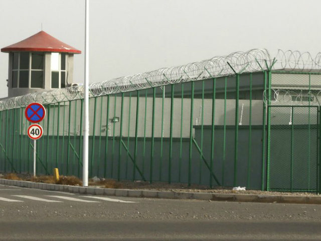 In this Monday, Dec. 3, 2018, photo, a guard tower and barbed wire fences are seen around