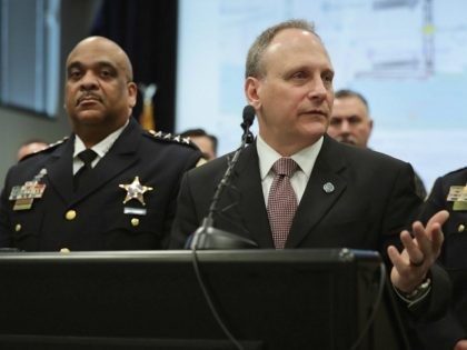 CHICAGO, ILLINOIS - FEBRUARY 21: Flanked by Chicago Police Superintendent Eddie Johnson, l