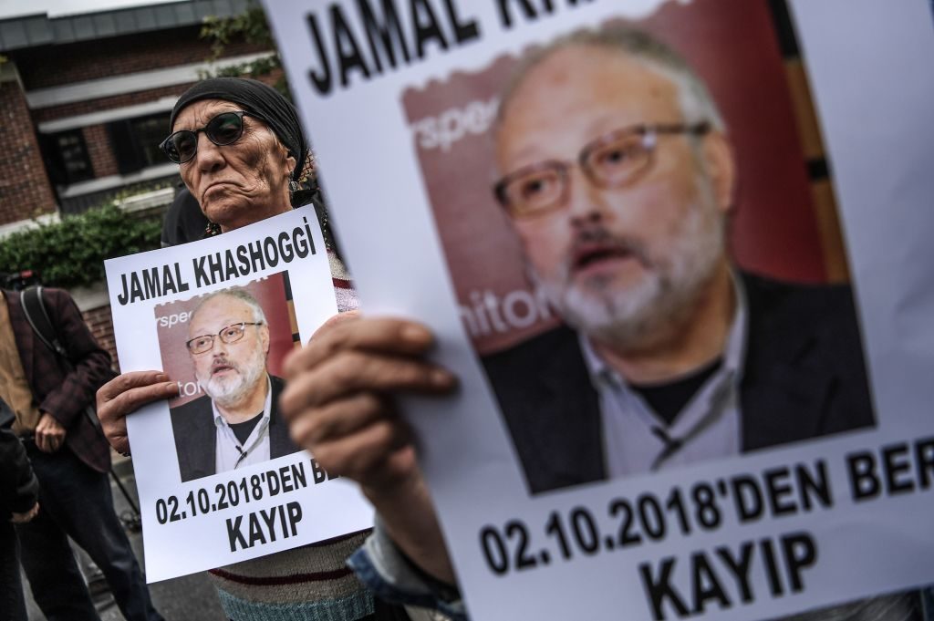 Protesters hold a portrait of journalist and Riyadh critic Jamal Khashoggi, who was killed in October 2018.