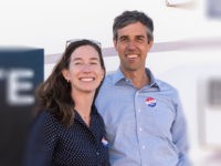 Texas Senatorial Candidate Congressman Beto ORourke and his wife, Amy Hoover Sanders, are pictured in front of a campaign RV outside of Nixon Elementary School in El Paso, Texas, on November 6, 2018. - Americans started voting Tuesday in critical midterm elections that mark the first major voter test of …