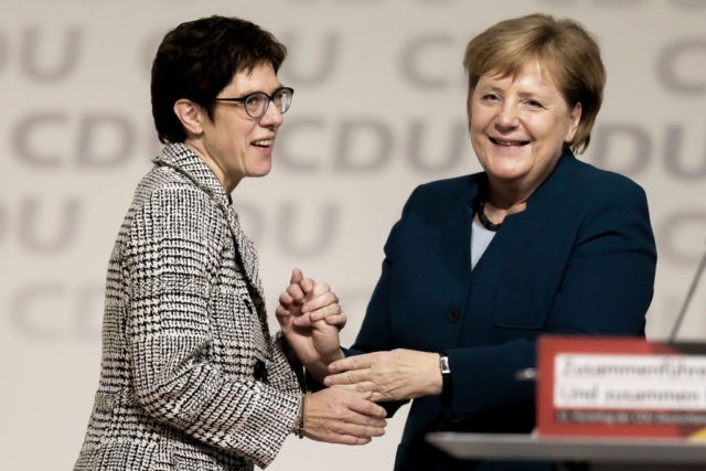 HAMBURG, GERMANY - DECEMBER 7: Annegret Kramp-Karrenbauer and Angela Merkel (R) react after after Kamp-Karrenbauer received the most votes to become the next leader of the German Christian Democrats (CDU) at a federal congress of the CDU on December 7, 2018 in Hamburg, German Chancellor and leader of the German …