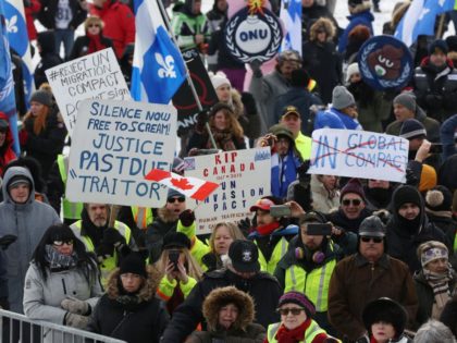 People rally against the UN international pact on migration, at Parliament Hill in Ottawa, Ontario, on December 8, 2018. - The Global Compact for Safe, Orderly and Regular Migration was finalized at the UN in July after 18 months of negotiations and is to be formally adopted on December 10, …