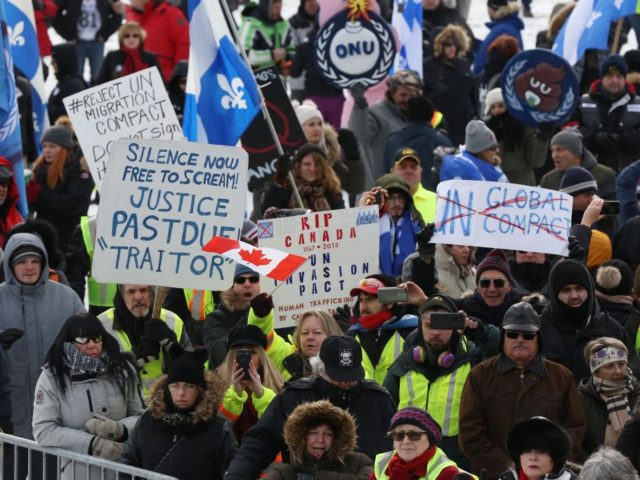 People rally against the UN international pact on migration, at Parliament Hill in Ottawa,