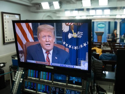 US President Donald Trump appears on a television screen in the Press Briefing Room of the White House in Washington, DC, on January 8, 2019, as he speaks during a presidential address about the government shutdown and border security from the Oval Office. - Trump demanded $5.7 billion to fund …