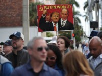 FORT LAUDERDALE, FLORIDA - JANUARY 25: A person holds a sign while waiting for Roger Stone, a former advisor to President Donald Trump, to leave the Federal Courthouse on January 25, 2019 in Fort Lauderdale, Florida. Mr. Stone was charged by special counsel Robert Mueller of obstruction, giving false statements …