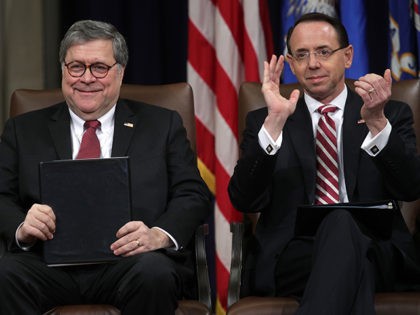 WASHINGTON, DC - FEBRUARY 26: U.S. Attorney General William Barr (L) and Deputy Attorney General Rod Rosenstein (R) attend a Department of Justice African American History Month Observance Program at the Department of Justice February 26, 2019 in Washington, DC. (Photo by Alex Wong/Getty Images)