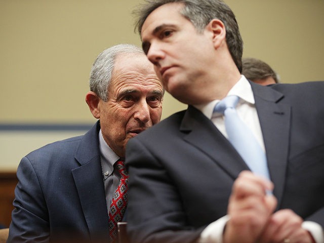 WASHINGTON, DC - FEBRUARY 27: Michael Cohen, former attorney and fixer for President Donald Trump, listens to his lawyer Lanny Davis as he testifies before the House Oversight Committee on Capitol Hill February 27, 2019 in Washington, DC. Last year Cohen was sentenced to three years in prison and ordered …