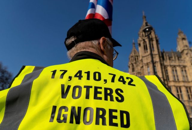 Pro-Brexit activists demonstrate near the Houses of Parliament in central London on March