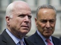 US Senator Chuck Schumer (R)D-NY, and Senator John McCain, R-AZ, speak to the media outside of the West Wing of the White House in Washington, DC, July 11, 2013, following a meeting regarding immigration reform with US President Barack Obama. AFP PHOTO / Saul LOEB (Photo credit should read SAUL …