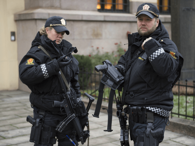 Armed police officers are seen outside the Nobel institute in Oslo on December 9, 2014. Due to a heightened terror alert the police have responded by instructing its officers to carry weapons throughout the Christmas season. AFP PHOTO / ODD ANDERSEN (Photo credit should read ODD ANDERSEN/AFP/Getty Images)