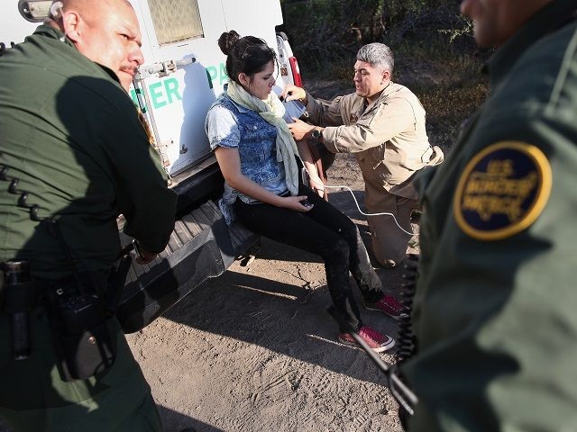 LA GRULLA, TX - DECEMBER 10: A U.S. Border Patrol medic takes the blood pressure of an und