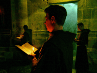 JERUSALEM, -: A Franciscan monk prays during a procession at the Saint Sepulchre in Jerusalem 24 August 2005. AFP PHOTO/ NICOLAS ASFOURI (Photo credit should read NICOLAS ASFOURI/AFP/Getty Images)