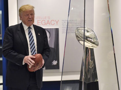 Republican presidential nominee Donald Trump (L) tours the Pro Football Hall of Fame with Hall of Fame President David Baker on September 14, 2016 in Canton, Ohio. / AFP / MANDEL NGAN (Photo credit should read MANDEL NGAN/AFP/Getty Images)