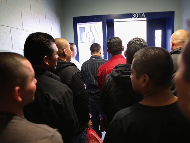 Immigrants prepare to be set free from the Adelanto Detention Facility on November 15, 2013 in Adelanto, California. The center, the largest and newest Immigration and Customs Enforcement (ICE), detention facility in California, houses an average of 1,100 immigrants in custody pending a decision in their immigration cases or awaiting …