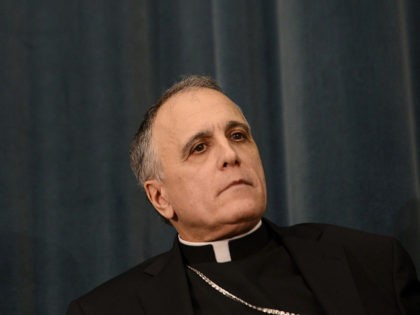 US cardinal Daniel DiNardo listens during a press conference at the North American College