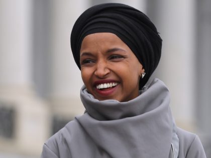 Rep. Ilhan Omar (D-MN) rallies with fellow Democrats before voting on H.R. 1, or the Peopl