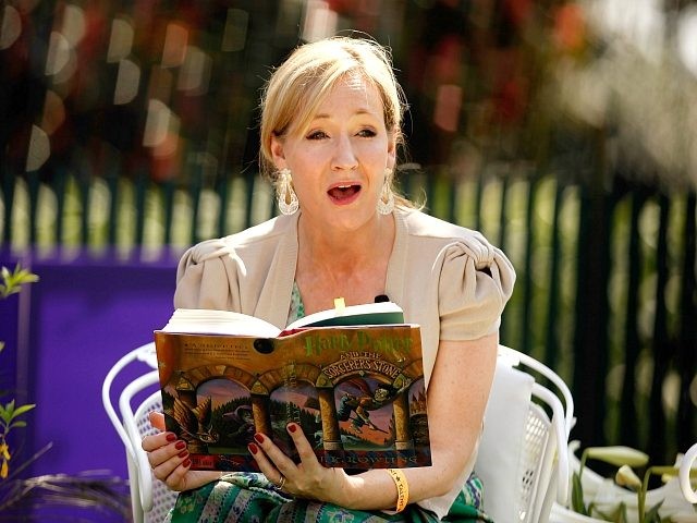 WASHINGTON - APRIL 05: British author J.K. Rowling, creator of the Harry Potter fantasy series, points to the place on her forehead where her title character has a scar while reading 'Harry Potter and the Sorcerer's Stone' during the Easter Egg Roll on the South Lawn of the White House …