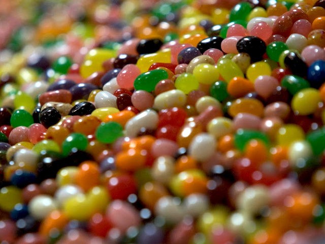 Jelly beans sit in a bin waiting to be packaged on the assembly line at the Jelly Belly Fa