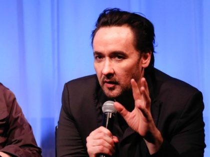 NEW YORK, NY - JUNE 04: Oren Moverman (L) and John Cusack attend Official Academy Screening of 'Love & Mercy' hosted by The Academy of Motion Picture Arts and Sciences at The Academy Theatre at Lighthouse International on June 4, 2015 in New York City. (Photo by Rob Kim/Getty Images …