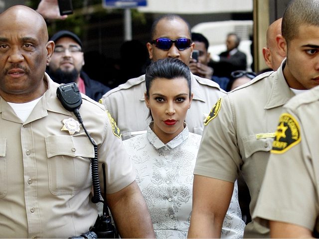 LOS ANGELES, CA - APRIL 12: Kim Kardashian surrounded by Los Angeles County Sheriff Deputies leaves the Stanley Mosk Courthouse after attending her divorce hearing from Kris Humphries on April 12, 2013 in Los Angeles, California. Kim Kardashian and NBA player Kris Humphries are appearing for divorce proceedings. Humphries is …