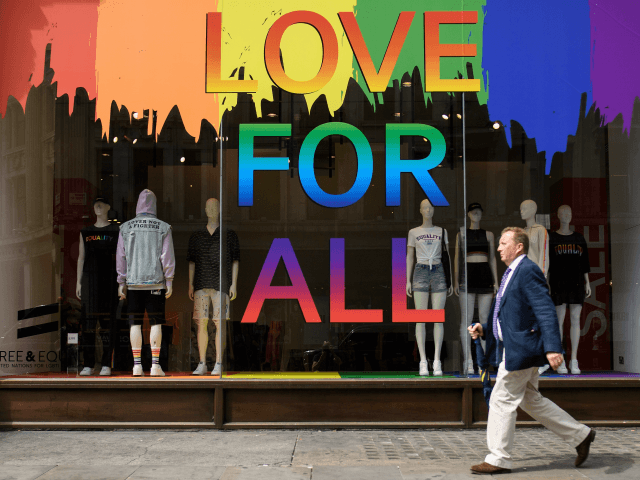 LONDON, ENGLAND - JULY 04: A Pride rainbow is seen in the window of the H&M clothing store