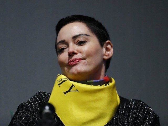 Actress Rose McGowan speaks on a panel at the inaugural Women's Convention in Detroit, Friday, Oct. 27, 2017. McGowan recently went public with her allegation that film company co-founder Harvey Weinstein raped her. (AP Photo/Paul Sancya)