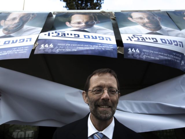 Moshe Feiglin, ruling rightwing Likud party candidate, leaves a polling station after cast