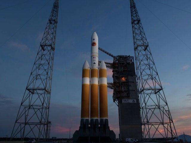 In this handout provided by NASA, The United Launch Alliance Delta IV Heavy rocket with the Parker Solar Probe onboard is seen shortly after the Mobile Service Tower was rolled back, Friday, Aug. 10, 2018, Launch Complex 37 at Cape Canaveral Air Force Station in Florida. Parker Solar Probe is …