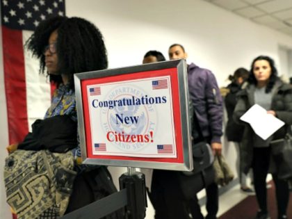 Immigrants wait in line to become U.S. citizens at a naturalization ceremony on February 2, 2018 in New York City. U.S. Citizenship and Immigration Services (USCIS) swore in 128 immigrants from 42 different countries during the ceremony at the downtown Manhattan Federal Building. (Photo by John Moore/Getty Images)