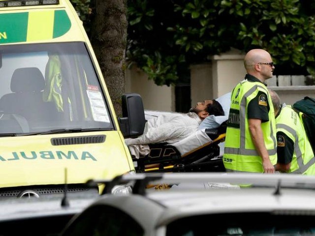 Ambulance staff take a man from outside a mosque in central Christchurch, New Zealand, Fri