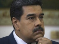 Venezuela's President Nicolas Maduro listens during an interview with The Associated Press at Miraflores presidential palace in Caracas, Venezuela, Thursday, Feb. 14, 2019. Even while criticizing Donald Trump's confrontational stance toward his socialist government, Maduro said he holds out hope of meeting the U.S. president to resolve an impasse over …