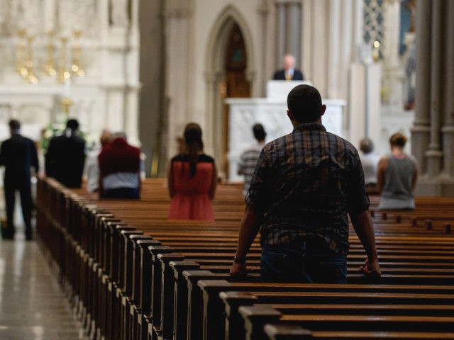 Parishioners worship during a mass to celebrate the Assumption of the Blessed Virgin Mary at St Paul Cathedral, the mother church of the Pittsburgh Diocese on August 15, 2018 in Pittsburgh, Pennsylvania.