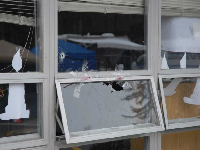 In this handout crime scene evidence photo provided by the Connecticut State Police, shows a damaged window at the Sandy Hook Elementary School following the December 14, 2012 shooting rampage, taken on an unspecified date in Newtown, Connecticut. A second report was released December 27, 2013 by Connecticut State Attorney …