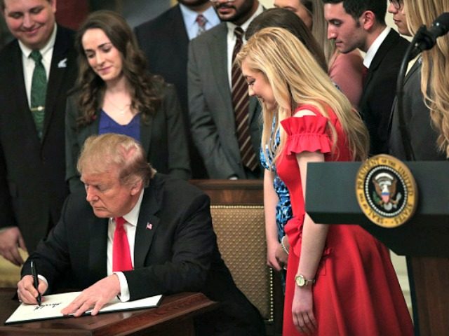 WASHINGTON, DC - MARCH 21: U.S. President Donald Trump signs an executive order during an