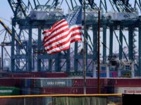 The US flag flies over Chinese shipping containers that were unloaded at the Port of Long Beach, in Los Angeles County, on September 29, 2018. - President Donald Trump insisted that there had been 'absolutely no impact' on the US economy from the escalating trade dispute between his administration and …