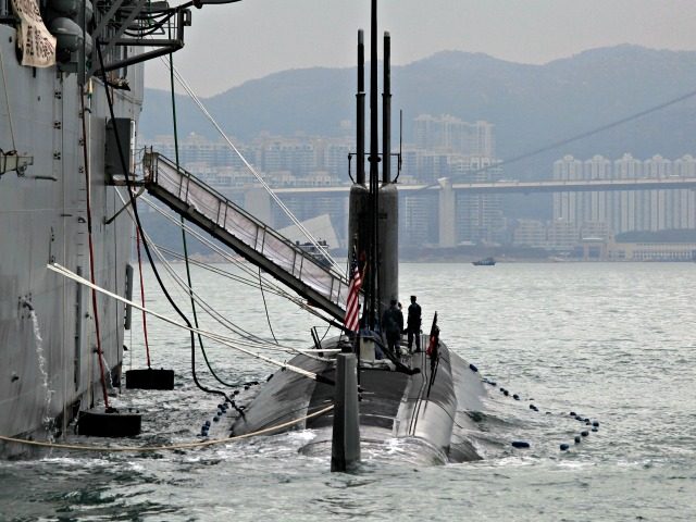 The Los Angeles-class, fast attack submarine USS Hampton (C) sits moored alongside the submarine tender USS Frank Cable (L) during a visit to Hong Kong on May 17, 2011. China is researching and deploying systems to fight U.S. submarines. (Vincent Yu/AFP/Getty Images)