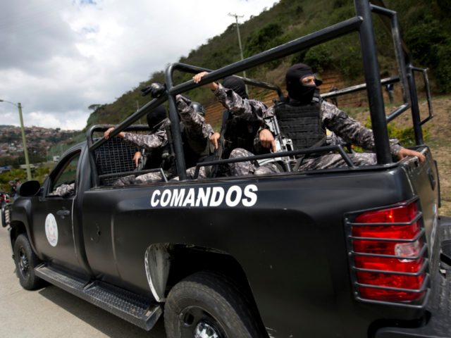 Members of the Venezuelan Bolivarian Intelligence Service arrive to the Junquito highway d