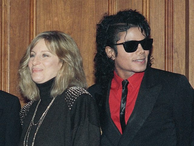 FILE - In this Dec. 14, 1986, file photo, singers Barbra Streisand and Michael Jackson att