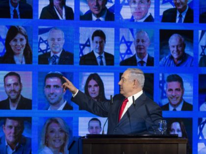 RAMAT GAN, ISRAEL - MARCH 04: Israel's Prime Minster Benjamin Netanyahu points to photos of Likud party members as he delivers a speech during the launch of the Likud party election campaign on March 4, 2019 in Ramat Gan, Israel. (Photo by Amir Levy/Getty Images)