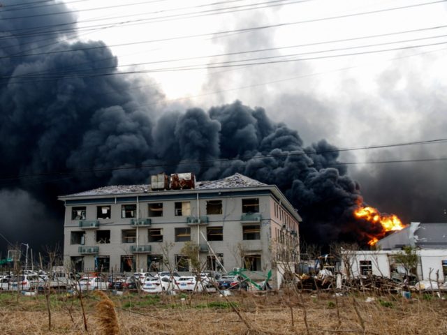 This photo taken on March 21, 2019 shows fire and smoke rising at an explosion site in Yancheng in China's eastern Jiangsu province. - The death toll from a huge explosion at a chemical plant in eastern China surged to 47 on Friday, making it one of the country's worst …