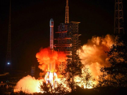 A Long March 3B rocket lifts off from the Xichang launch centre in Xichang in China's southwestern Sichuan province early on December 8, 2018. - China launched a rover early on December 8 destined to land on the far side of the moon, a global first that would boost Beijing's …