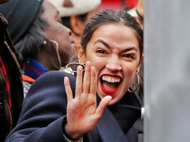 U.S. Rep. Alexandria Ocasio-Cortez, D-New York, waves to supporters as she arrives at a rally organized by Women's March NYC at Foley Square in Lower Manhattan, Saturday, Jan. 19, 2019, in New York. (AP Photo/Kathy Willens)