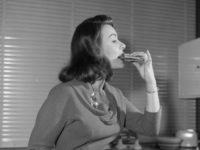 April 1958: British film actress Anne Heywood tasting a low calorie vegetarian hamburger made with breadcrumbs, walnuts, cheese and carrots. (Photo by Ken Harding/BIPs/Getty Images)