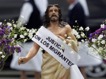 Guatemala City, GUATEMALA: A figure of Jesus which asks for 'justice with the migrants and no more deportations' is pictured in the Constitution Place where members of the Episcopal Conference take part in the Via Crucis of the Migrant in the Historic Centre of Guatemala City, 23 March 2007. The …