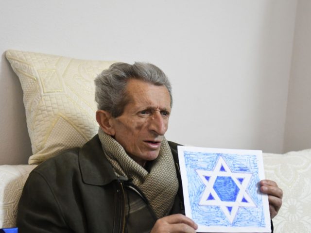 Simon Vrusho, 75-years-old, the founder of the Solomon Jewish history museum in the Albanian city of Berat, speaks with an AFP journalist on February 6, 2019. - The Balkan state is the only Nazi-occupied territory whose Jewish population increased during World War II, thanks to the bravery of ordinary families …