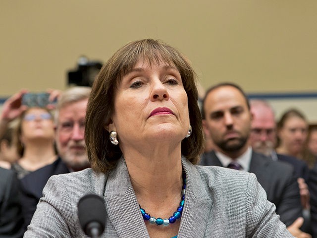 FILE - In this May 22, 2013 file photo, Lois Lerner, head of the IRS unit that decides whether to grant tax-exempt status to groups, listens on Capitol Hill in Washington. Lerner, the official at the center of the agency’s tea party scandal is retiring. Lerner headed the IRS division …